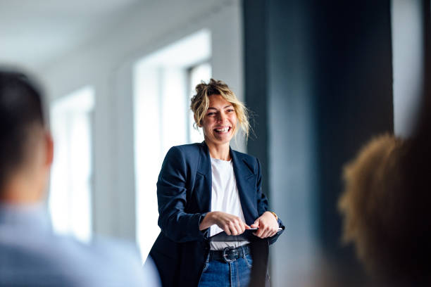 female executive presenting to room